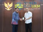 Ketua KPPU saat menemui Menteri Koperasi dan UKM (MenKopUKM) Teten Masduki